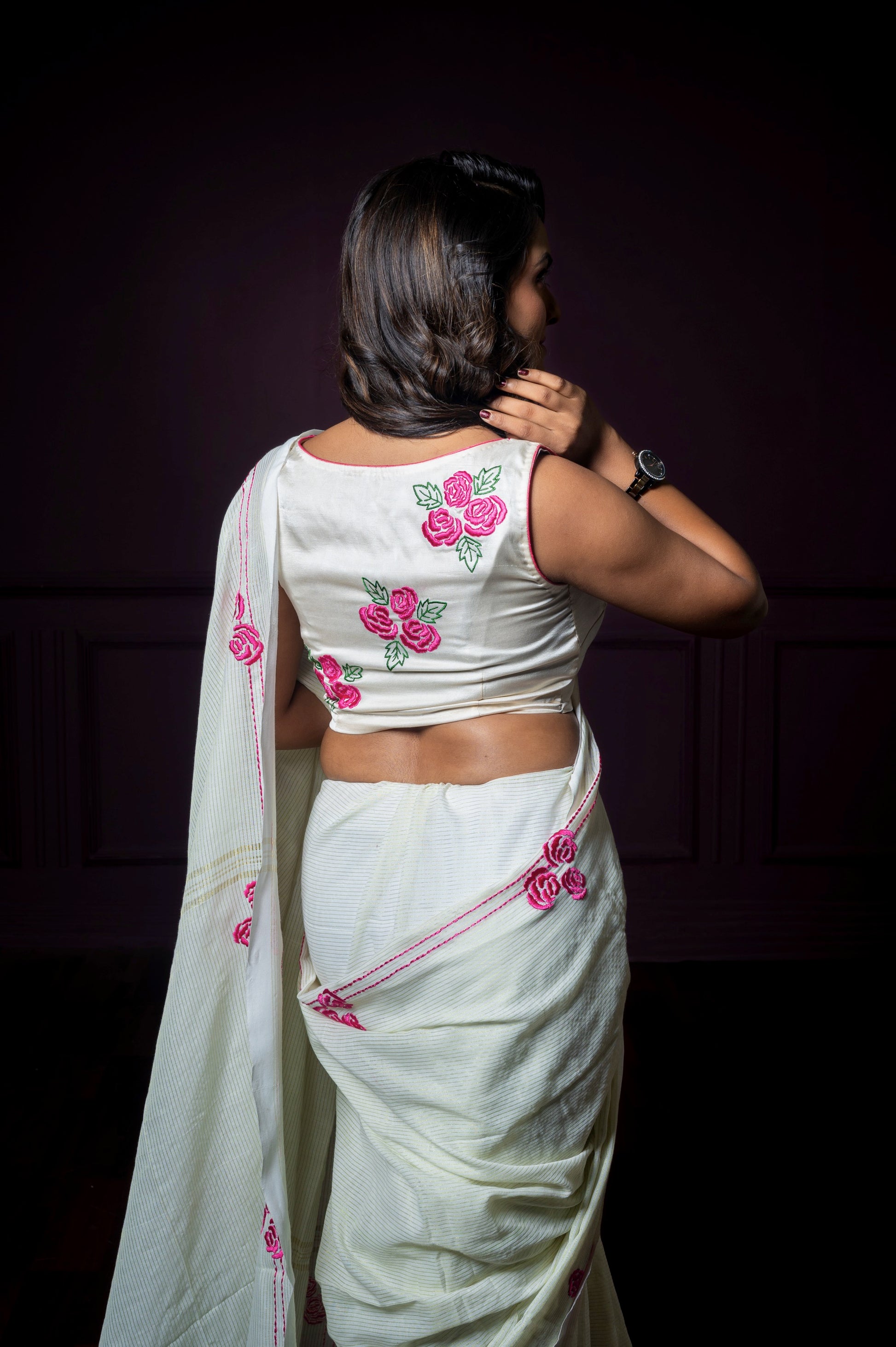 Back view of the Gul-e-Bahar blouse featuring vibrant pink floral embroidery and clean back coverage.