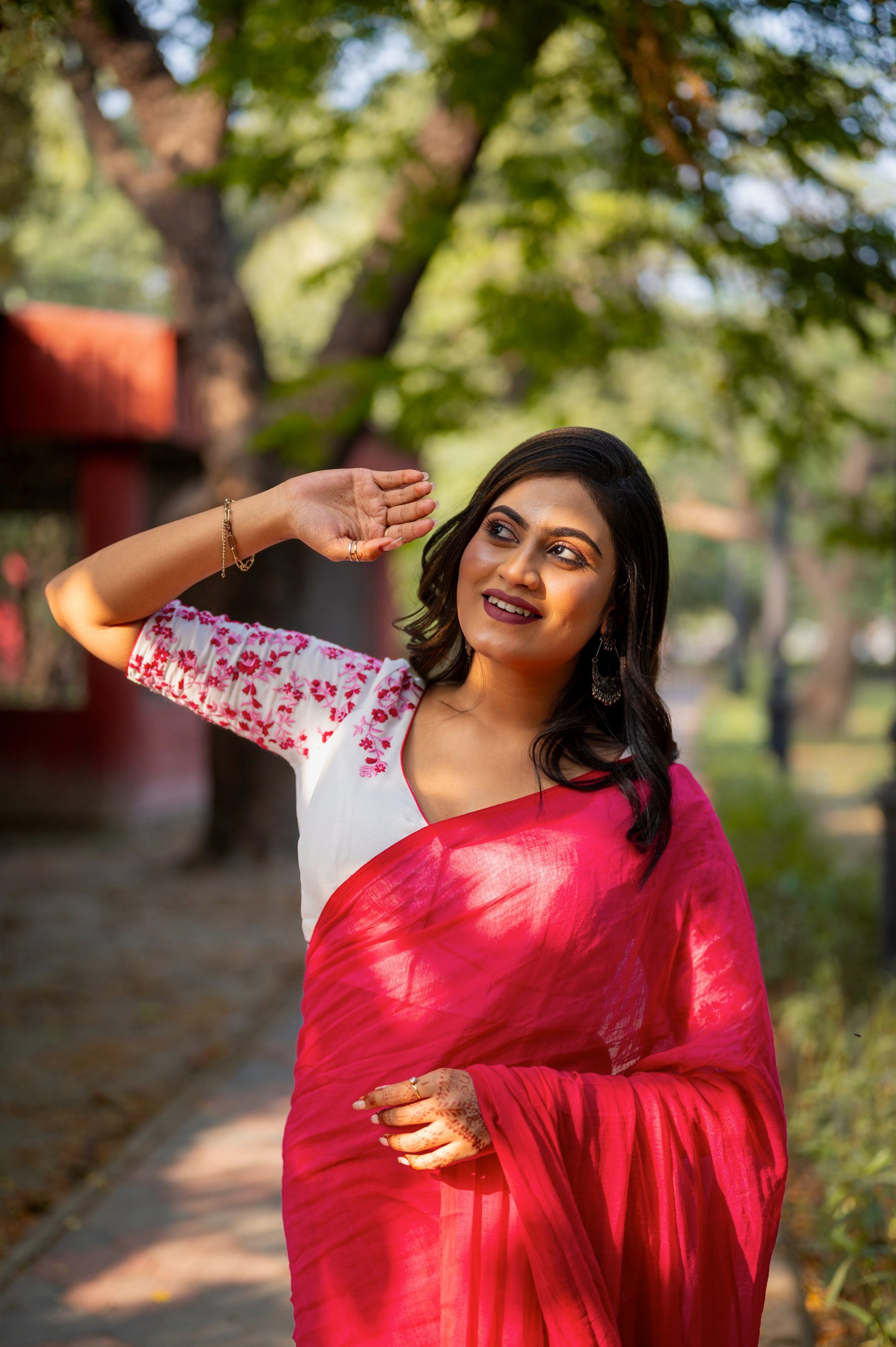 Dusty rose pink blouse with delicate floral embroidery and elbow-length sleeves